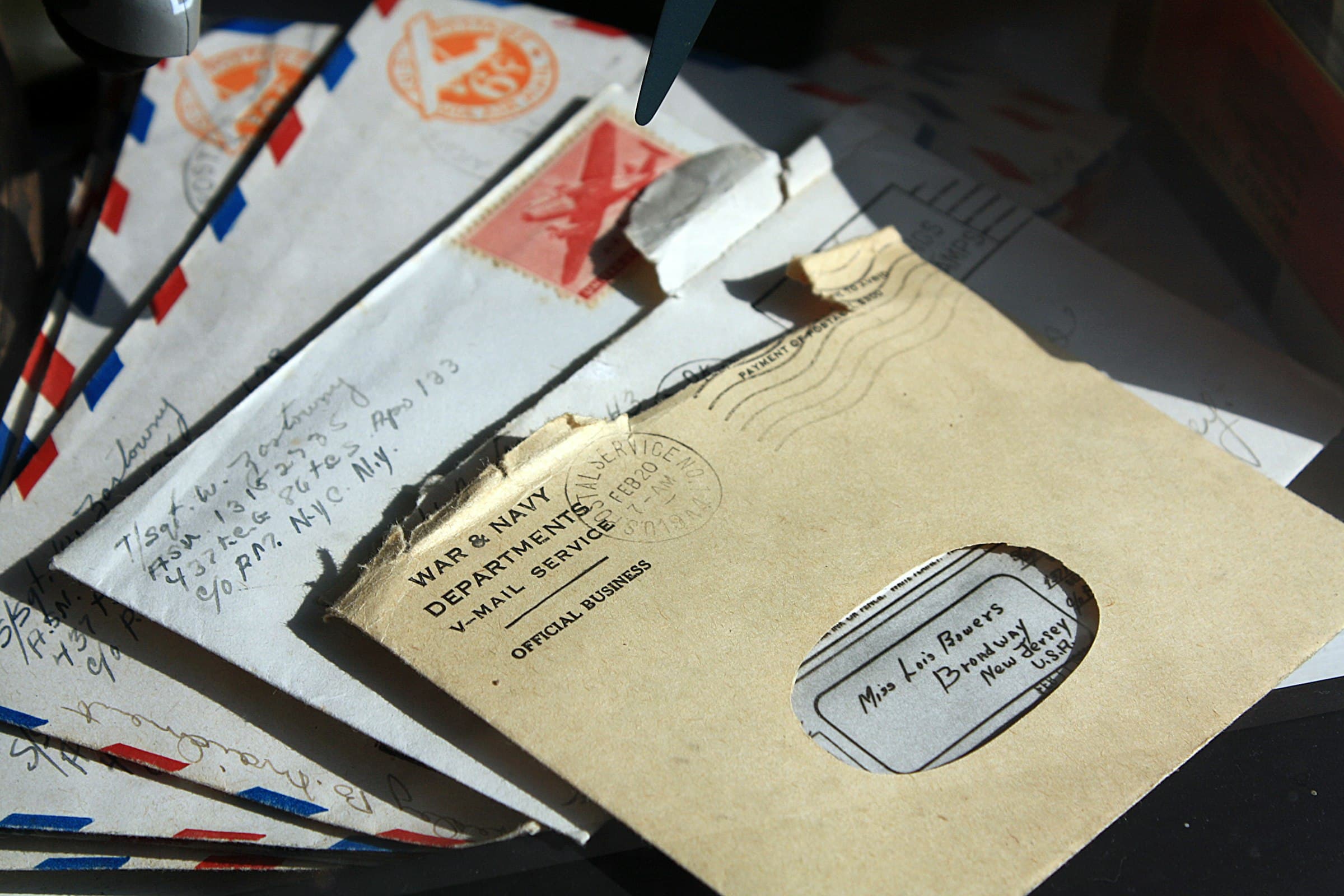A pile of opened letters and envelopes.